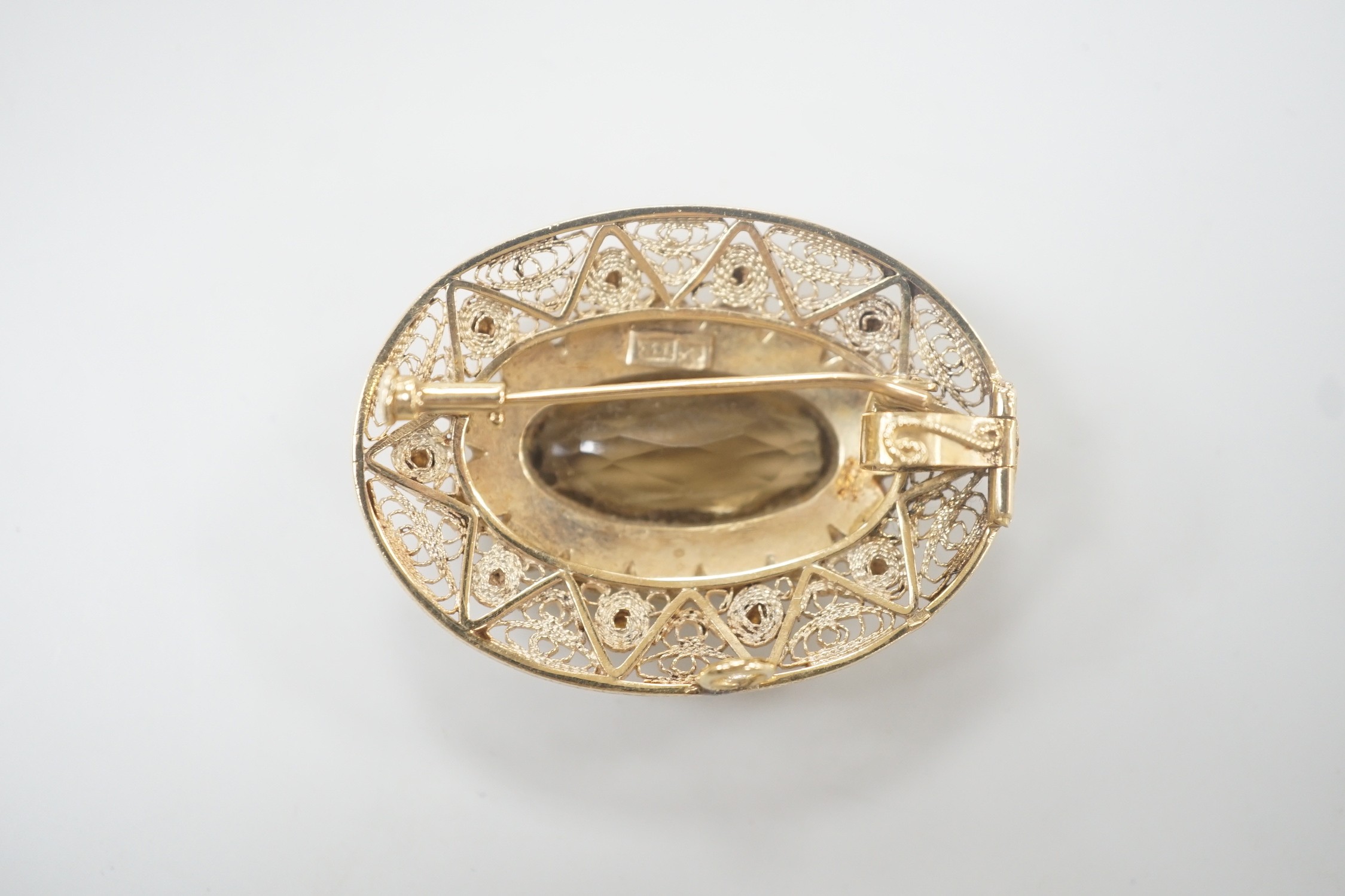 A 14k, oval cut citrine and split pearl cluster set oval brooch, 43mm, gross weight 17.8 grams.